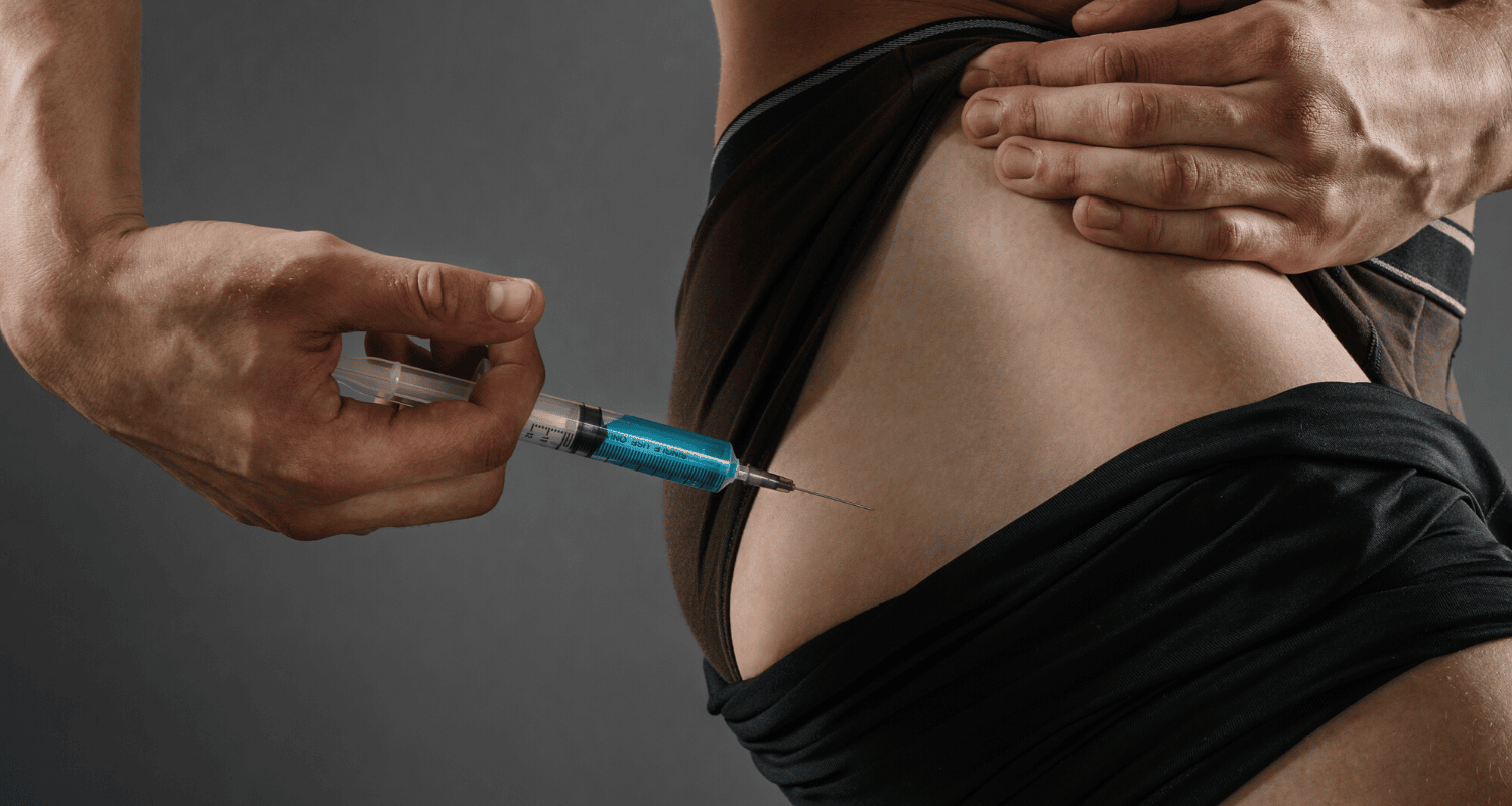 Person administering a steroid injection into the side of the abdomen, emphasizing safe injection techniques related to fitness and bodybuilding.